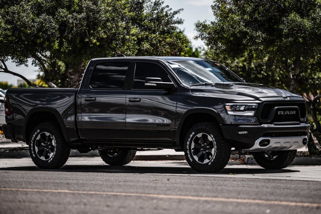 black-dodge-ram-1500-crew-cab-pickup-truck-parked-near-tree-2253737