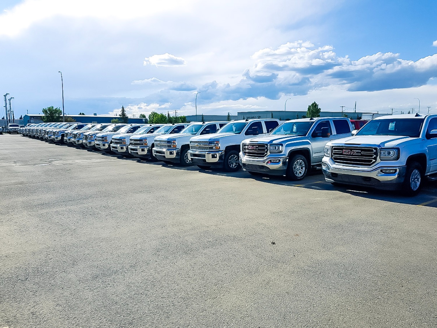 Mixed fleet vehicles on Canadian highway — truck and electric vehicle.